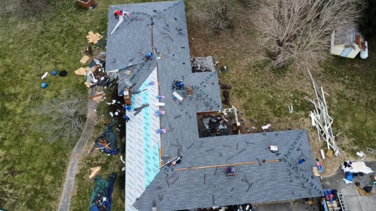 Aerial view of an L-shaped roof partway through replacement